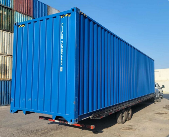 Shipping container being delivered on a truck