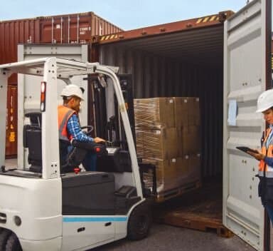 Forklift loading shipping container - containers for business operations